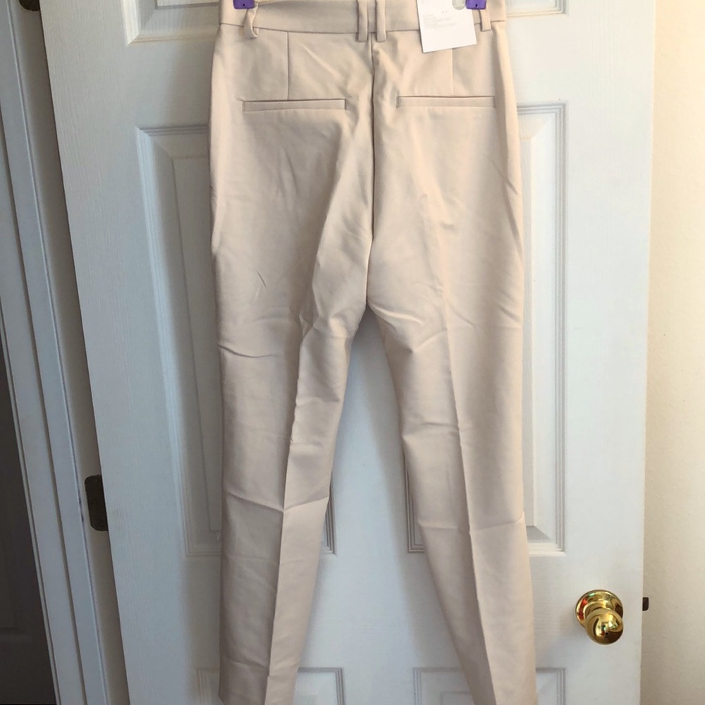 H&M ladies regular waist slacks size 4 brand new with tags cream colored